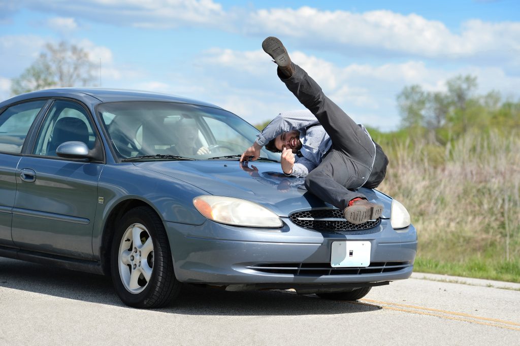 Man Being Hit by Car