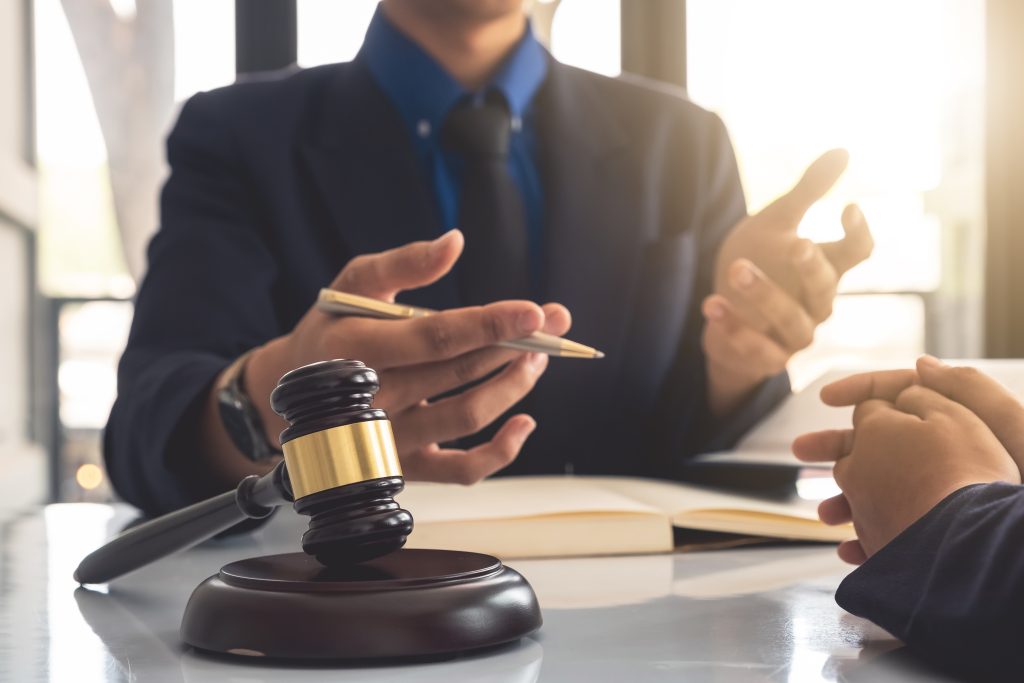Business lawyer working about legal legislation in courtroom to help their customer