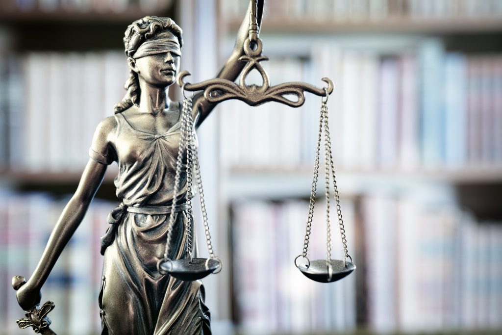 Legal and law statue of Lady Justice scales of justice and books
