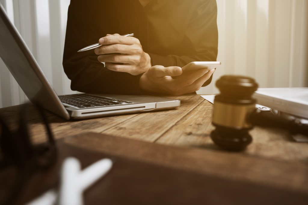 Young lawyer working hard alone in his office